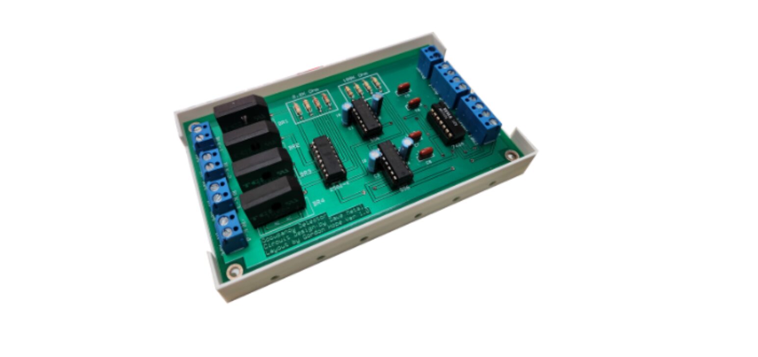 A green board with four relays and one blue button.